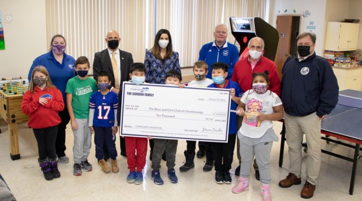 CEO Dave Gordon and Director of Communications Laura Gordon present a check to the Cheektowaga Boys & Girls Club.